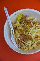 Thai spicy mango salad with spicy sauce