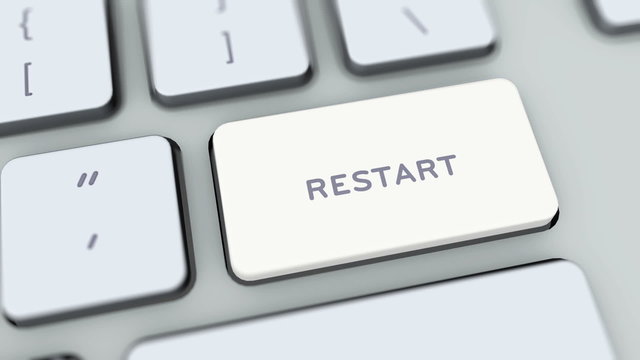 Restart button on computer keyboard. Key is pressed
