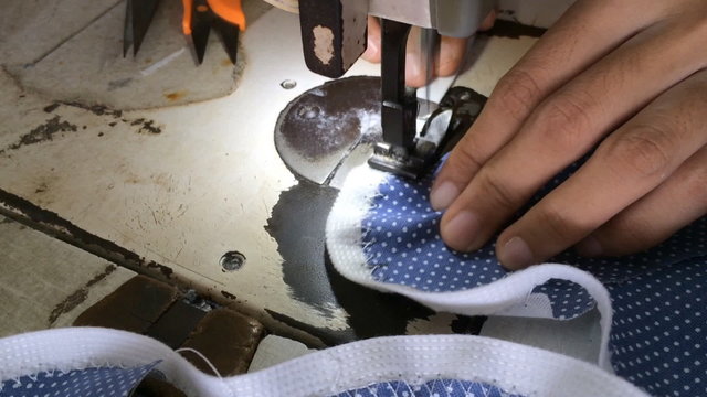 sewing machine stitching on textile
