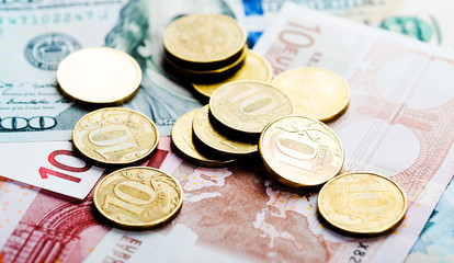 russian  coins on banknotes of dollars and euros
