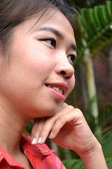 smiling young woman in traditional clothing from Laos