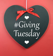 Giving Tuesday message greeting on heart blackboard