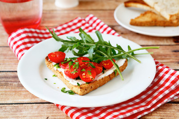 Bruschetta with tomatoes and arugula