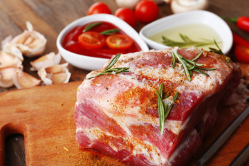 Raw meat on wooden table, close-up