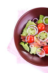 Appetizing fish salad with vegetables on plate isolated on