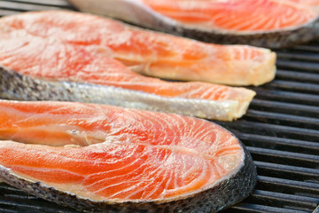 Portion of fresh salmon fillet on a grill