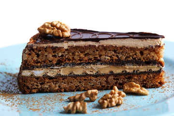 Delicious chocolate cake on plate on table close-up