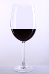 Red wine glass of wine isolated on white