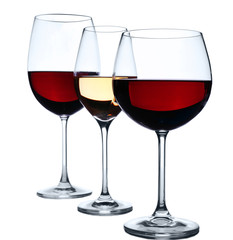 Wineglasses with red and white wine isolated on white