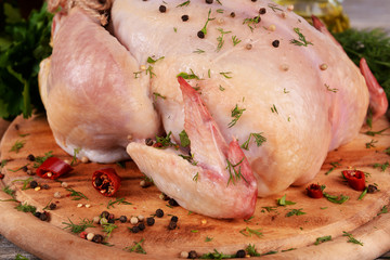 Raw chicken on wooden table