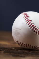 Baseball ball on wooden table