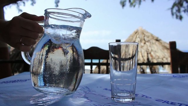 Glass of water and pitcher