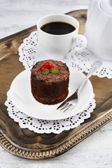 Breakfast in tray. Yummy chocolate cupcake and cup of coffee