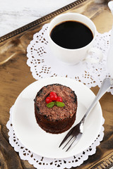 Breakfast in tray. Yummy chocolate cupcake and cup of coffee