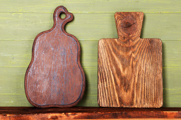 Empty cutting boards on wooden background