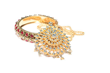 Close up of diamond necklace and bracelet on  white background