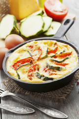 Omelette with zucchini and tomatoes