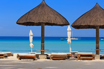 chairs on tropical white sand beach