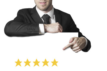 businessman in suit pointing on white sign isolated five star ra