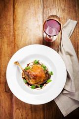 Glazed Christmas roast duck seasoned with oil, herbs, fig and an