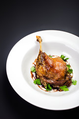 Glazed Christmas roast duck seasoned with oil, herbs, fig and an