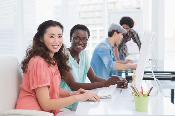 Young creative team working at desk