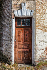 Fototapeta na wymiar Old brown painted door.