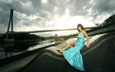 Attractive girl in long evening dress