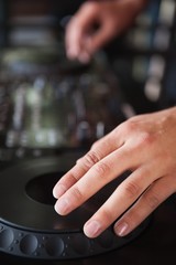 Close up of hands spinning the decks
