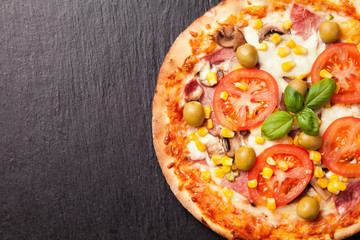 Delicious fresh pizza served on black stone