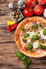 Delicious fresh pizza served on wooden table