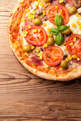 Delicious fresh pizza served on wooden table