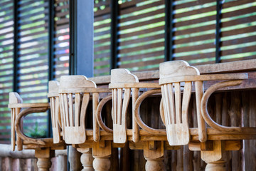 Old wooden chair in front of bar