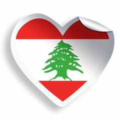 Heart sticker with flag of Lebanon isolated on white © okolaa