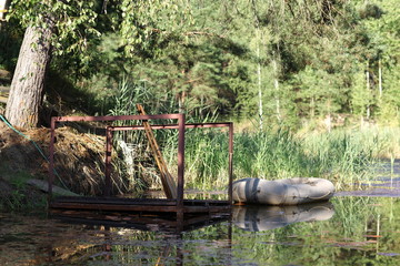 rubber boat anchored on the water