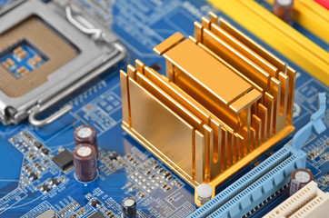 Printed computer motherboard with microcircuit, close up, DOF