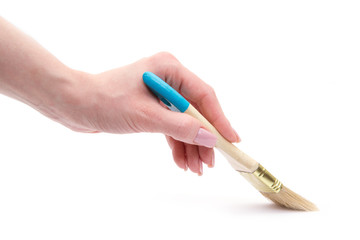 hand holding paint brush