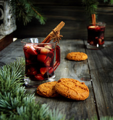 cups of hot Christmas mulled wine with cake