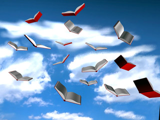 Open flying books on the blue sky
