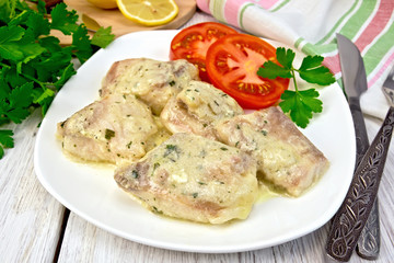 Fish stew in creamy sauce with tomatoes in plate © kostrez