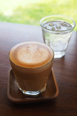 coffee latte art on wood desk