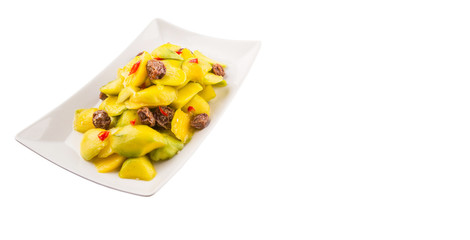 Pickled young mango with dried tamarind and chili slices
