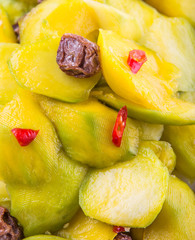 pickled young mango with dried tamarind and chili slices