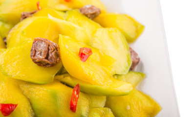 pickled young mango with dried tamarind and chili slices