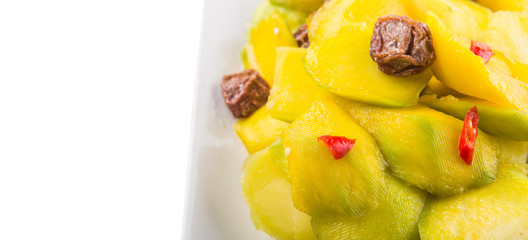 pickled young mango with dried tamarind and chili slices