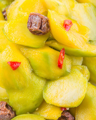 pickled young mango with dried tamarind and chili slices