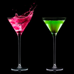 Fruity Schnapps. Stylish Cocktail Glasses isolated on Black.