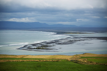 Black sand beach near Hvitserkur, giant rock in the Hunafloi bay