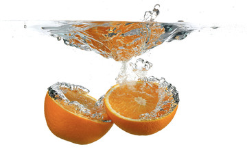 Divided orange in water