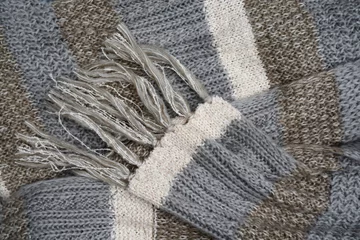 Tapeten Warme wollen sjaal met verschillende patronen en kleuren © trinetuzun